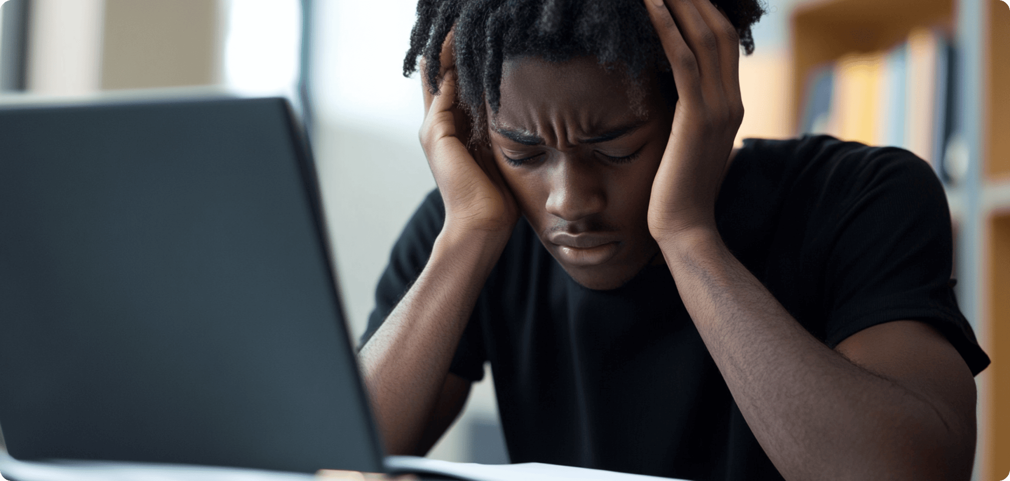 a student studying, looking stressed