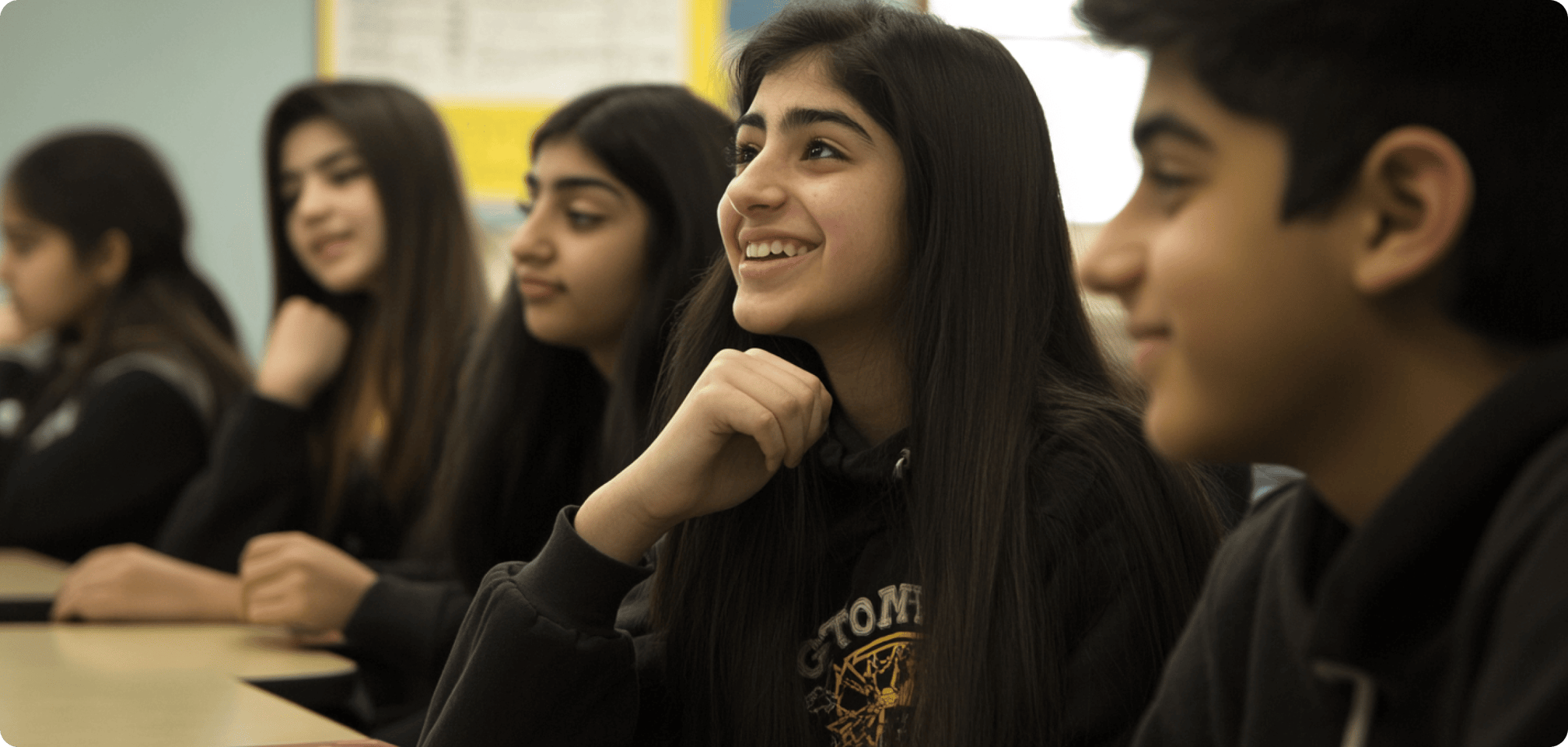 students sitting at desks in a classroom