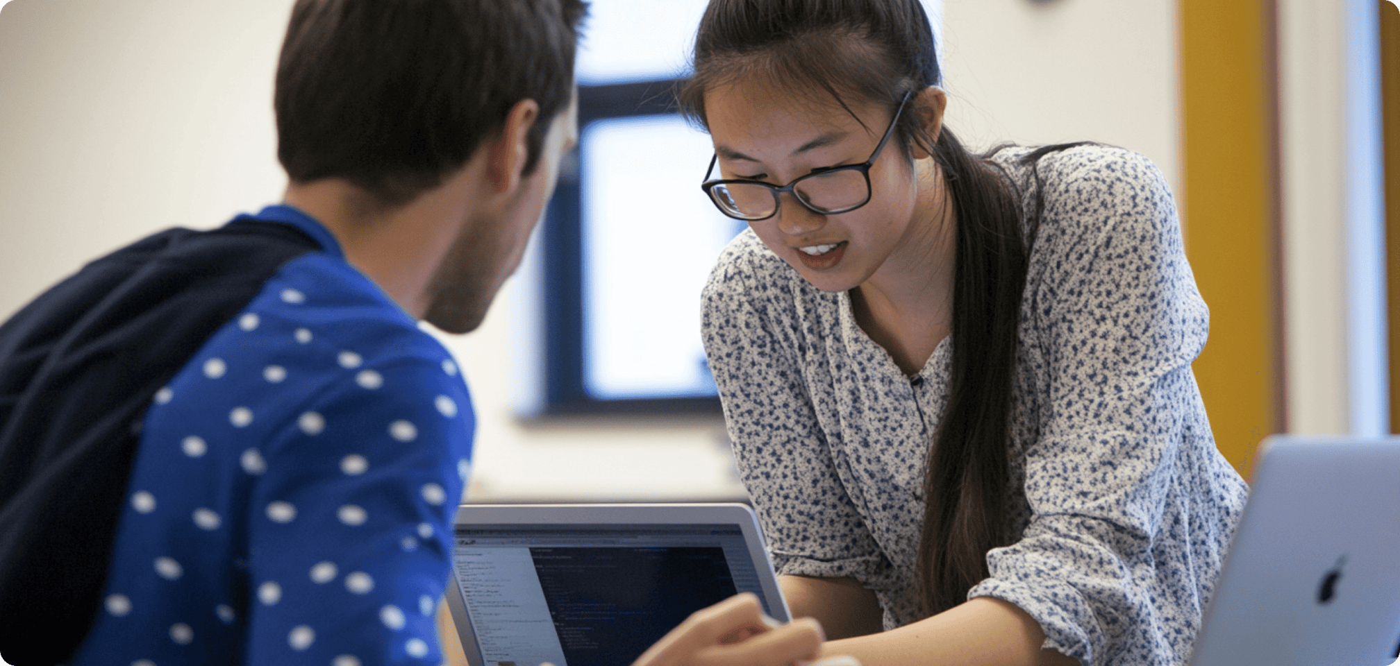 a student being helped by a teacher
