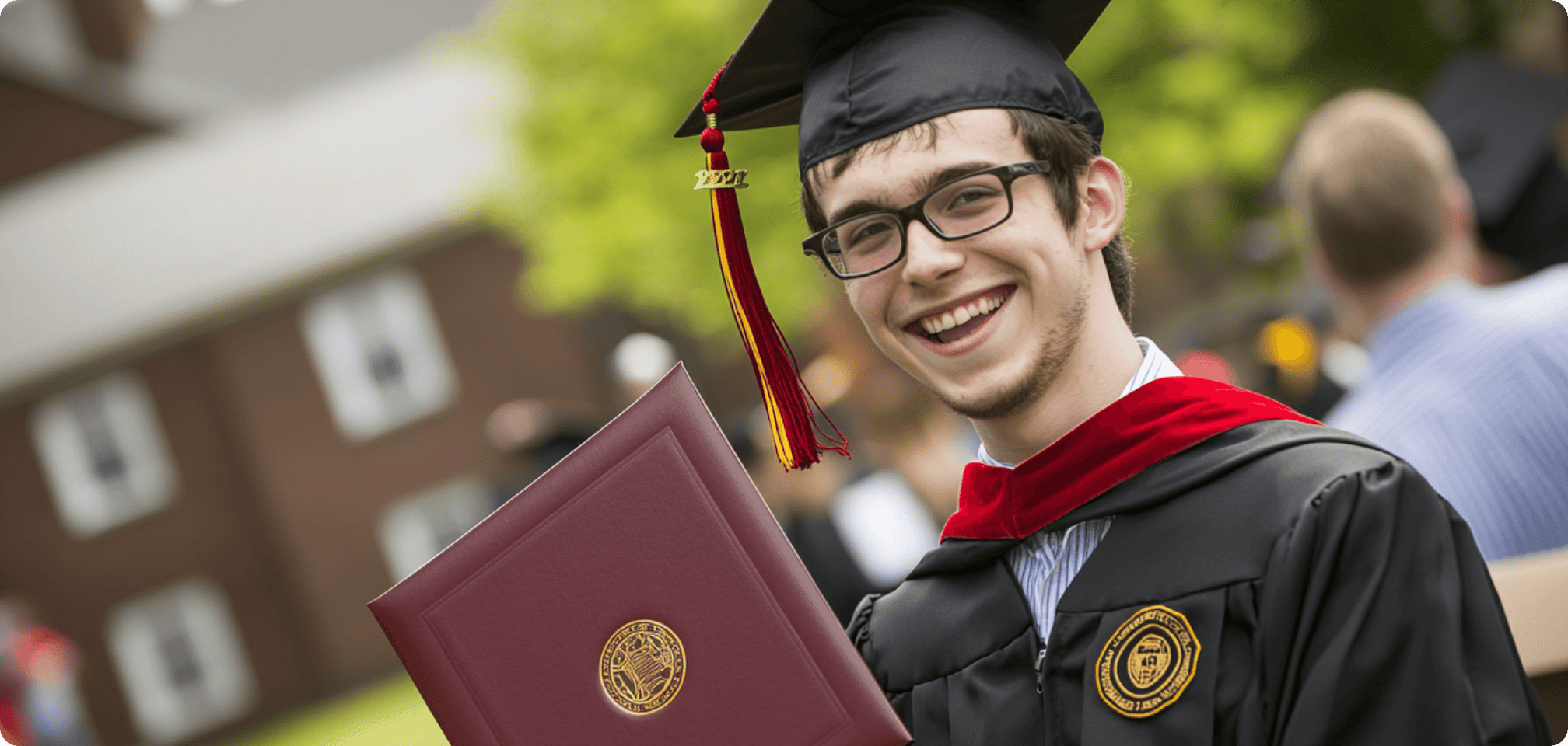 a student smiling with a diploma