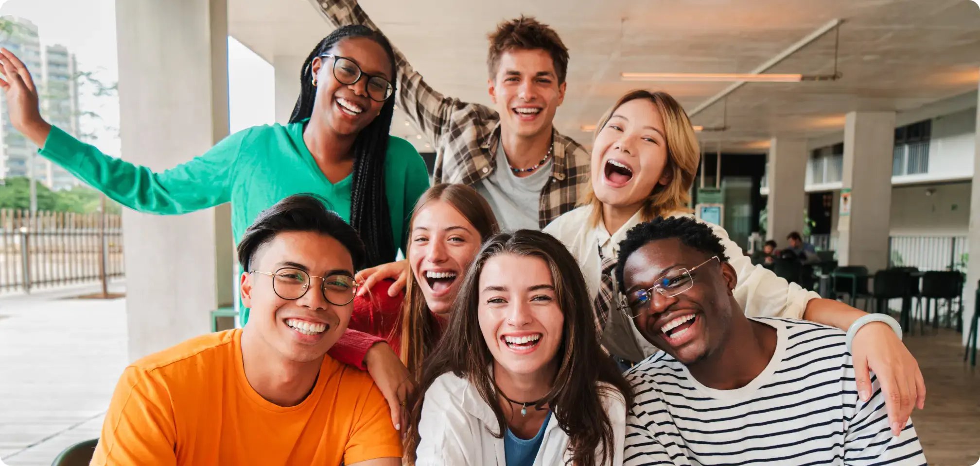 a student in a classroom with friends