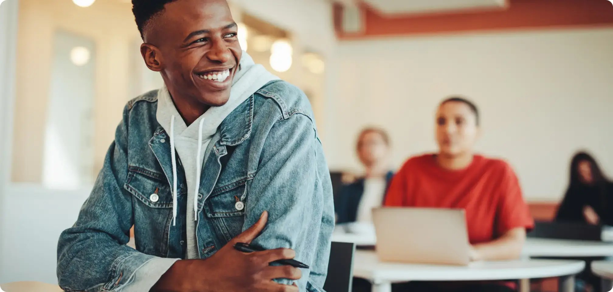 students smiling in a classroom