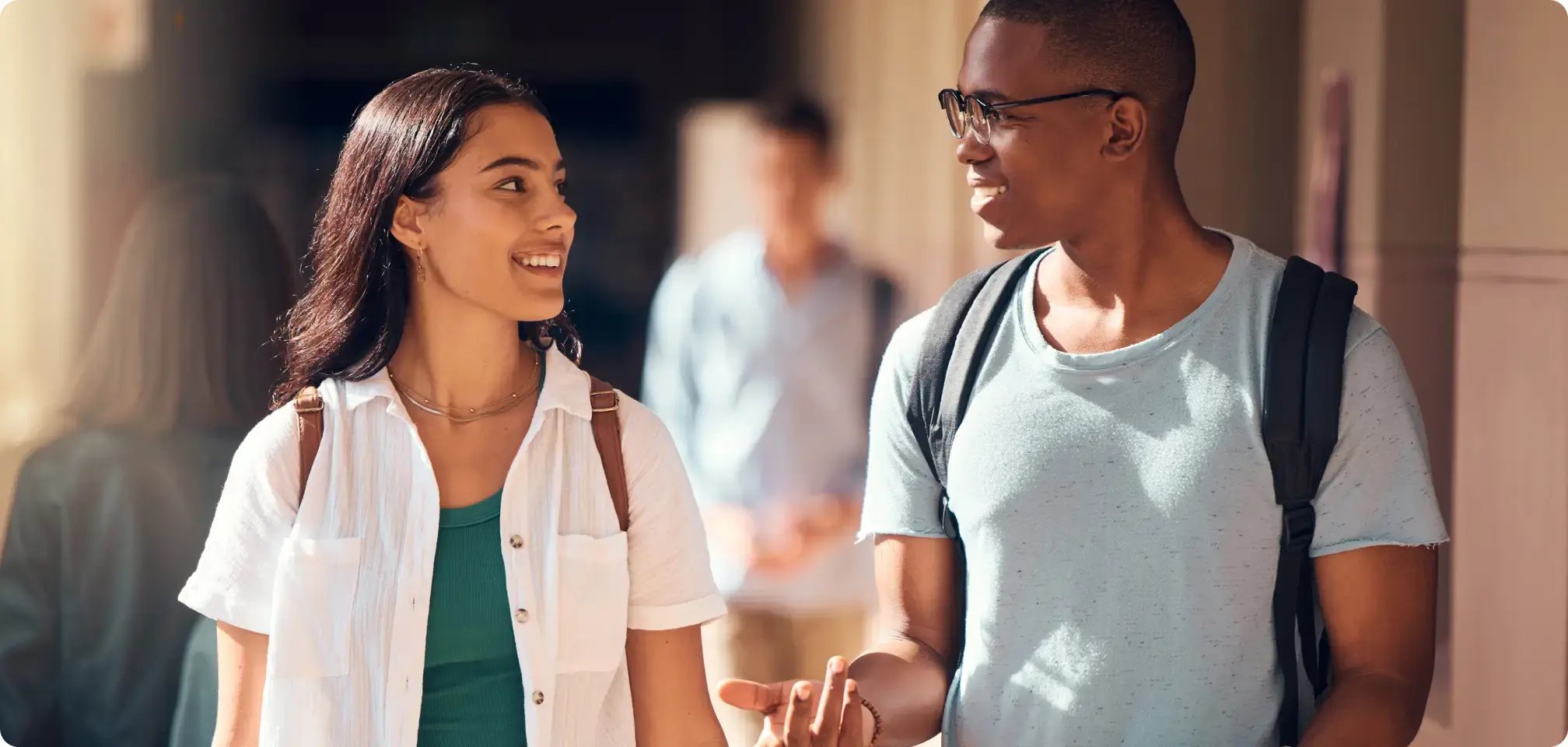 A student talk with a school counselor and smiling