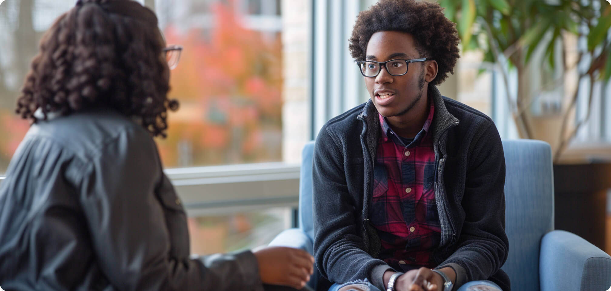 a student talking to a teacher