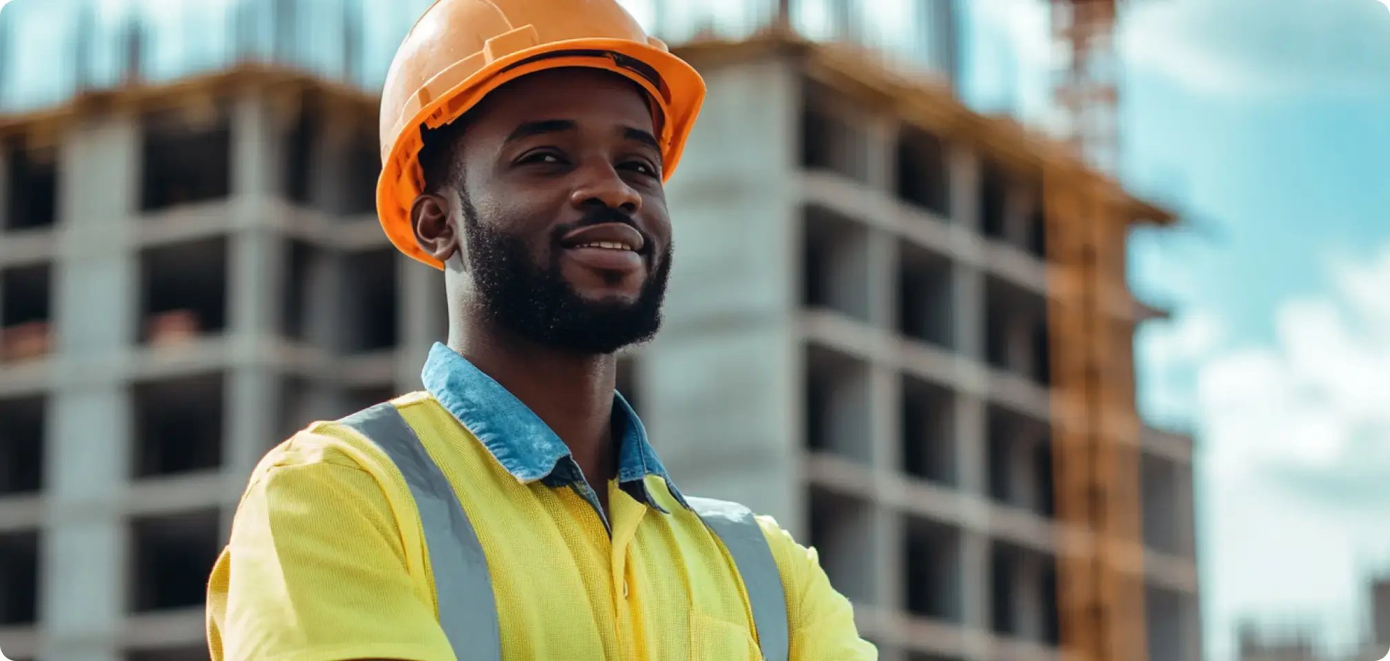 a young adult in construction uniform at construction site