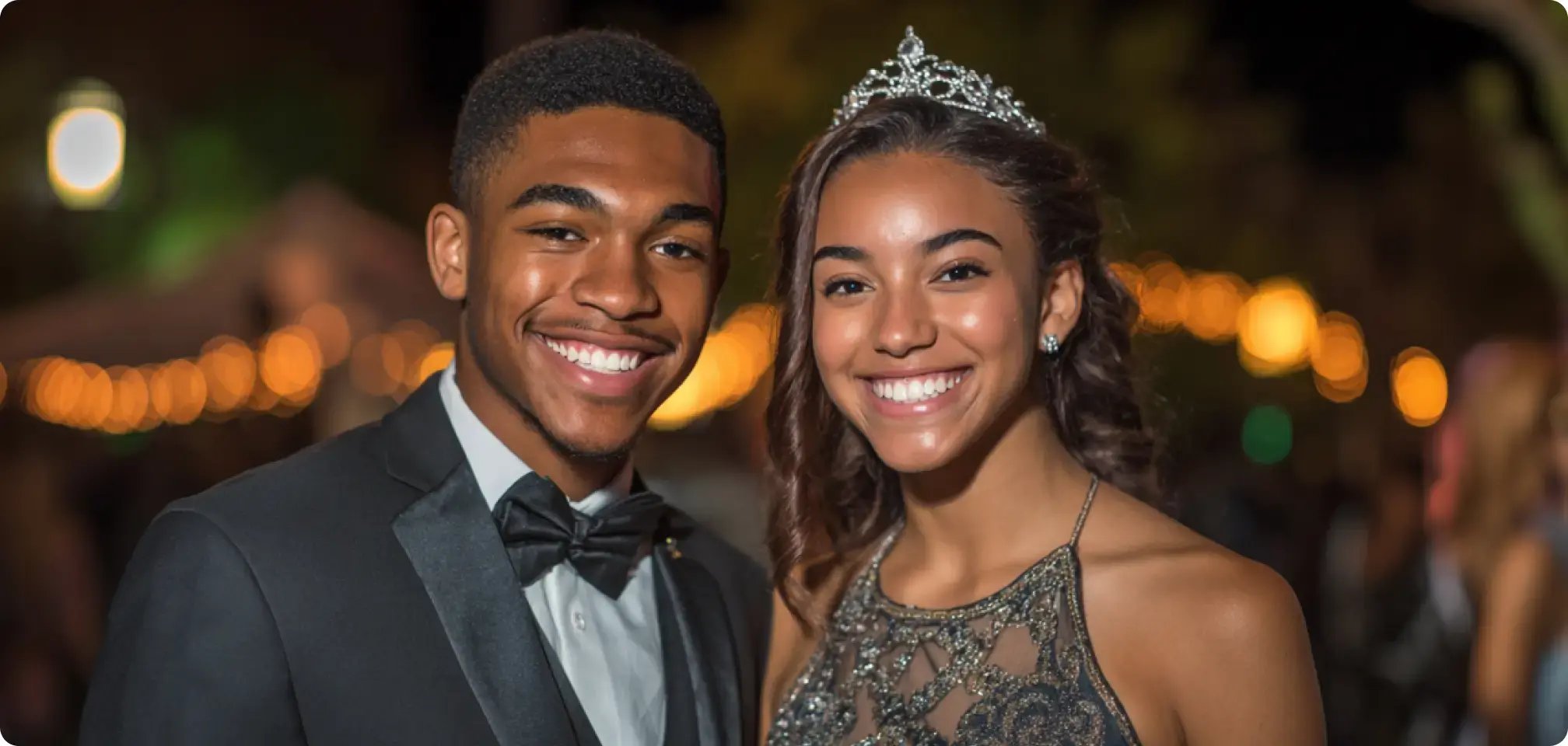 a Homecoming King and Queen in formal attire