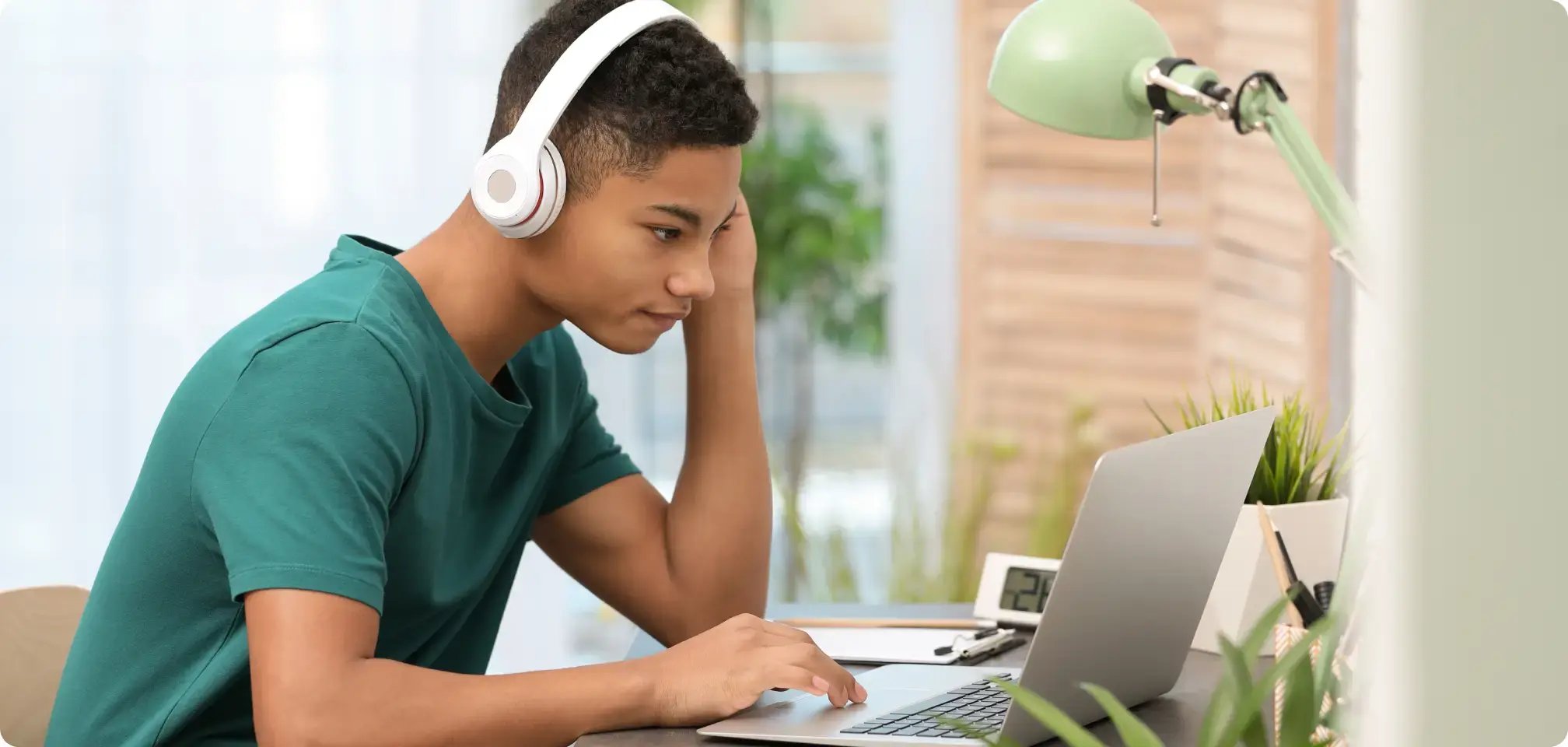 A student working on the computer at home