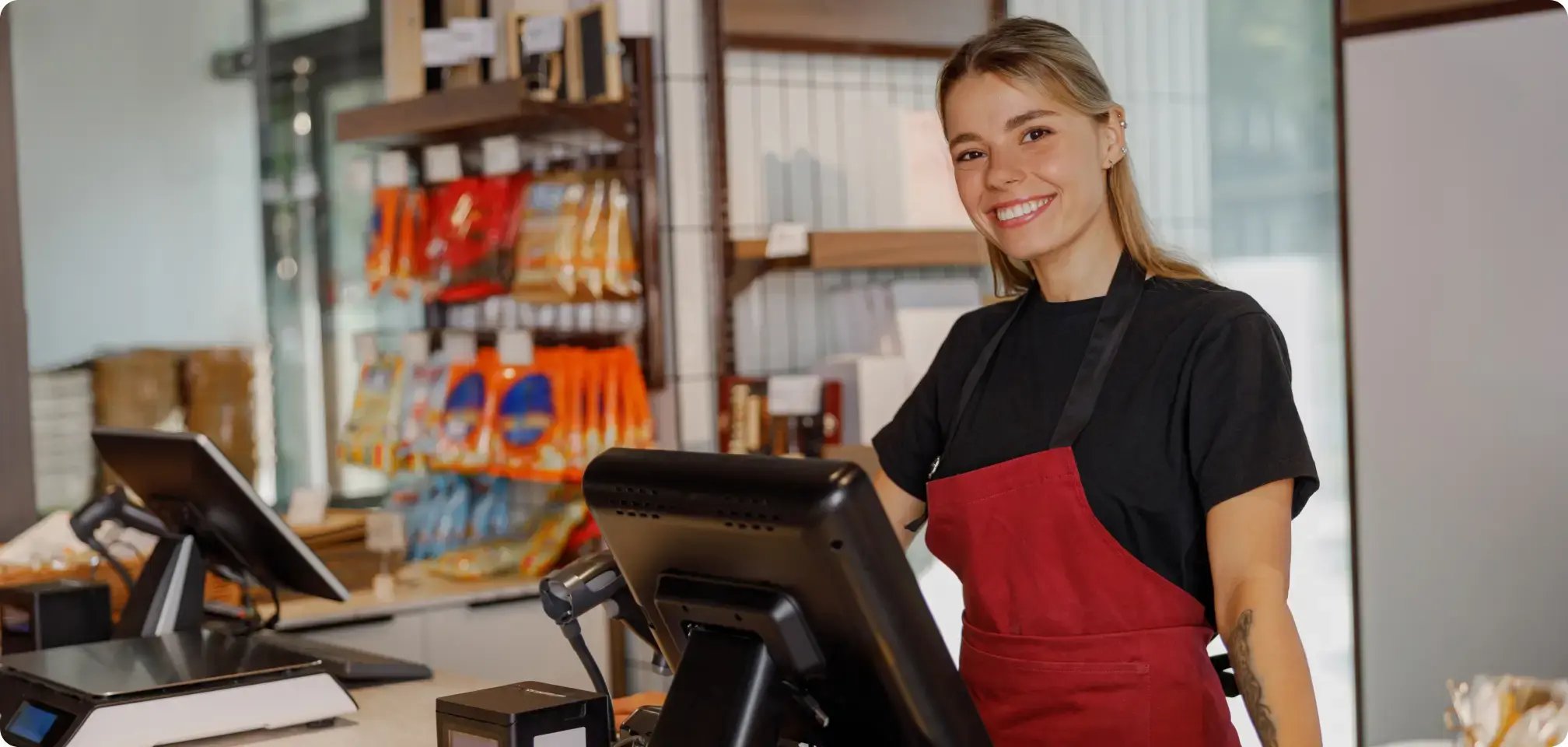 a student smiling in a work uniform