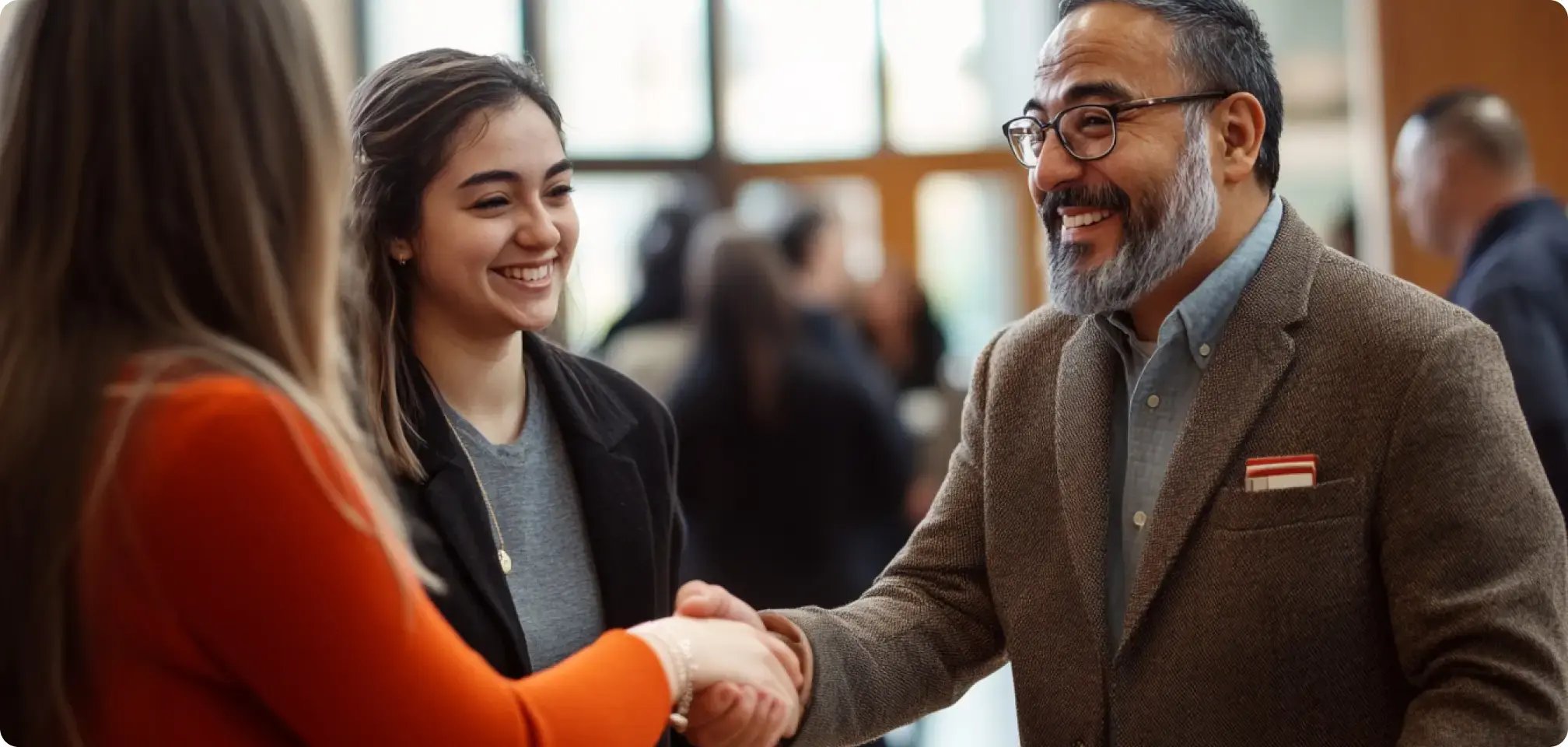 a student shaking hands with a professor