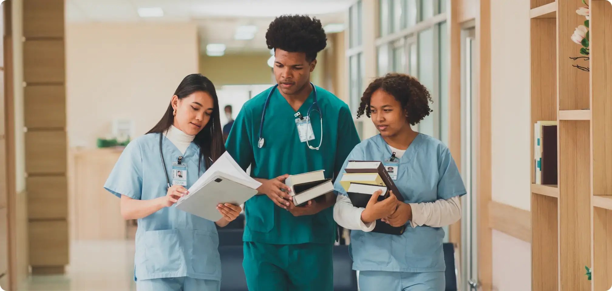 a student in scrubs at a medical facility
