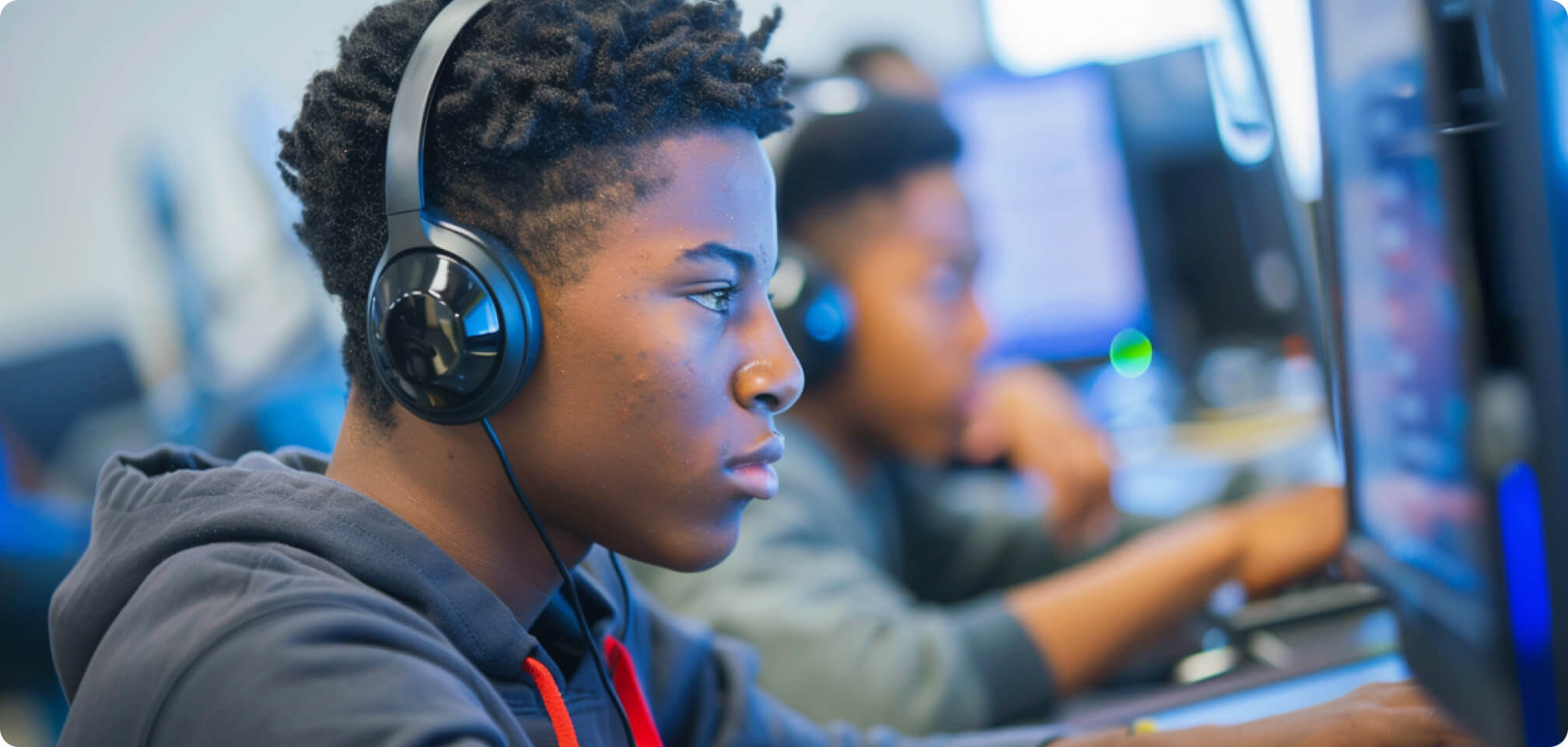 a student looking  at a computer screen