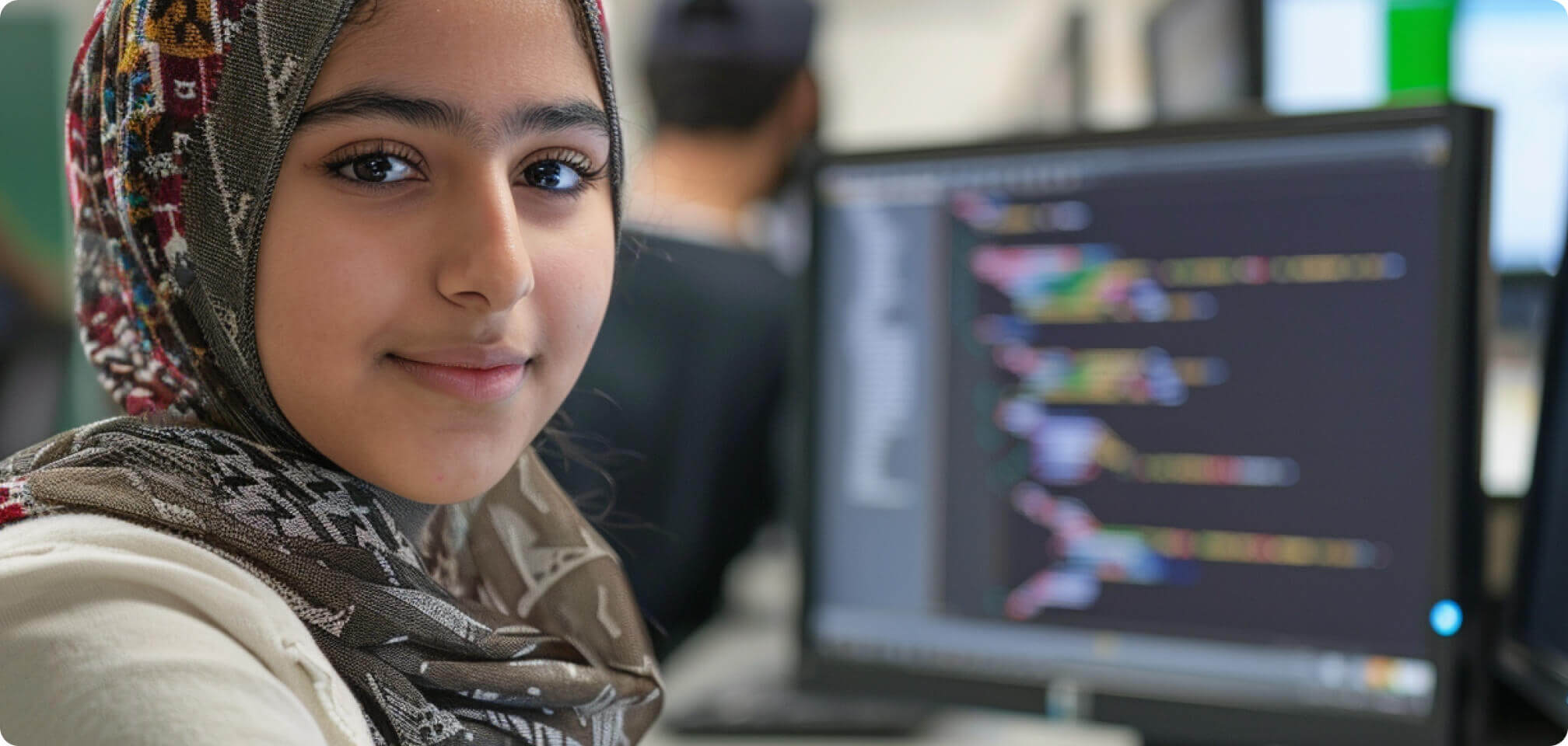 a student infront of a computer screen